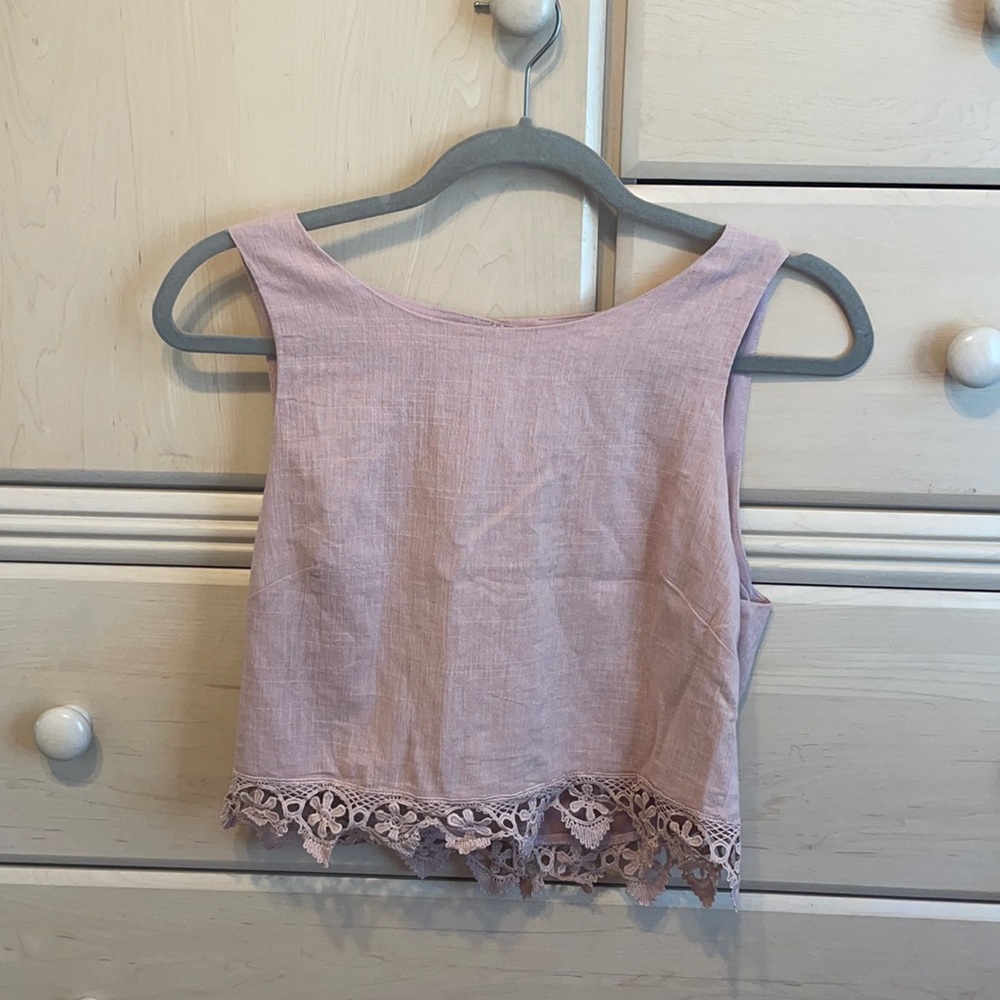 light pink tank top with detail at the bottom